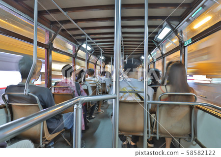 night view of moving tram at hong kong 58582122