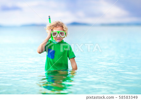 Kids snorkel. Children snorkeling in tropical sea. Kids snorkel. Children snorkeling in tropical sea. 58583349