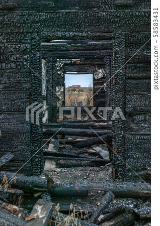 View from the window of a burnt wooden destroyed house in the cemetery. Mystical place. Vertical View from the window of a burnt wooden destroyed house in the cemetery. Mystical place. Vertical 58583431