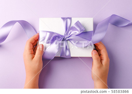 Christmas present stylish gift box in kids hands 58583866