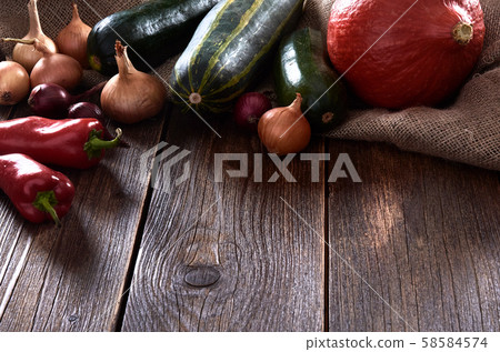 Still life on wooden table top. Pumpkin with 58584574