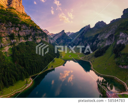 Aerial view of the Seealpsee lake in the Swiss Alps at sunset 58584783