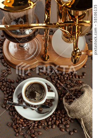 two cup with black coffee and geyser coffeepot two cup with black coffee and geyser coffeepot 58586135