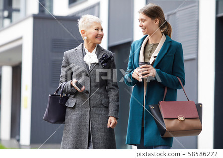 Mother and daughter outdoors 58586272