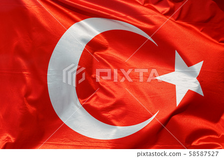 Flag of Turkey on a background of waving cotton texture. 58587527