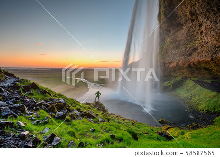 Beautiful Seljalandsfoss waterfall in Iceland during Sunset. 58587565