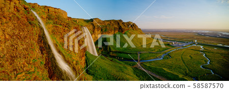 Beautiful Seljalandsfoss waterfall in Iceland during Sunset. Beautiful Seljalandsfoss waterfall in Iceland during Sunset. 58587570
