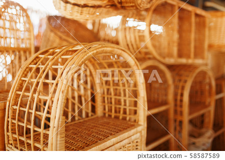 Handmade wicker furniture, products and souvenirs at the street craft market. 58587589
