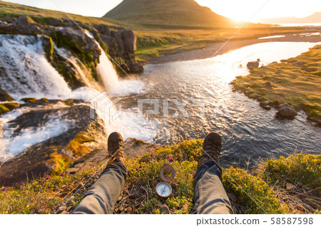 Beautiful landscape with old compass on traveler's hand. 58587598