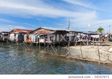Old wooden houses and footbridges on stilts 58587671