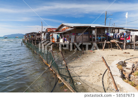 Poor wooden houses and footbridges on stilts Poor wooden houses and footbridges on stilts 58587673