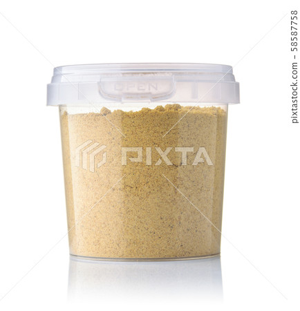Front view of ginger powder in plastic jar 58587758