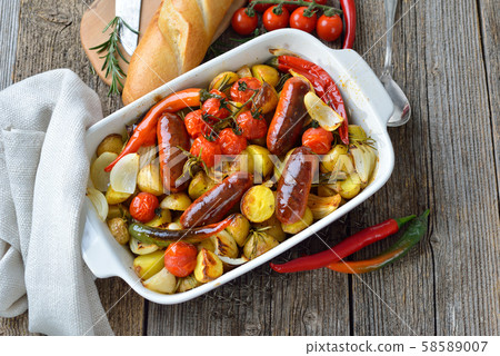 Mediterranean food: Baked Spanish chorizo sausages with rosemary baby potatoes and other vegetables Mediterranean food: Baked Spanish chorizo sausages with rosemary baby potatoes and other vegetables 58589007