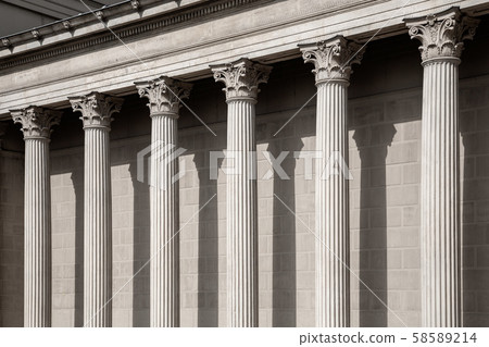 Vintage Old Justice Courthouse Column. Neoclassical colonnade with corinthian columns as part of a Vintage Old Justice Courthouse Column. Neoclassical colonnade with corinthian columns as part of a 58589214