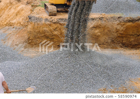 A excavator in a working to gravel construction A excavator in a working to gravel construction 58590974