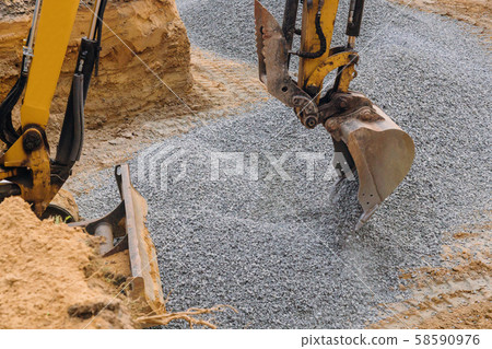 Excavator moving gravel in house under 58590976
