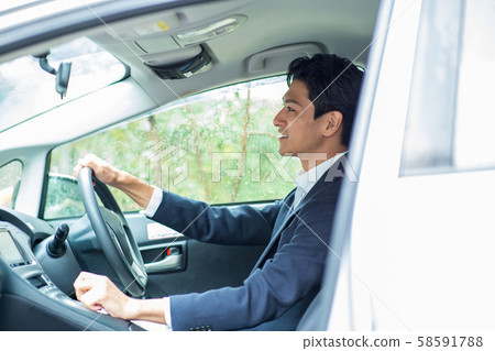 A man driving 58591788