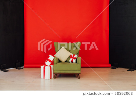 Red black background chair with gifts for Christmas birthday party Red black background chair with gifts for Christmas birthday party 58592068