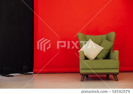 red black background green chair with pillows for rest 58592079