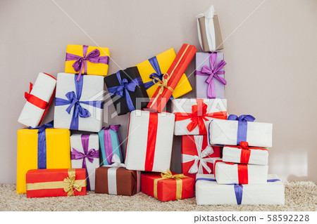 multi-colored gifts for the holiday on a gray Christmas background 58592228
