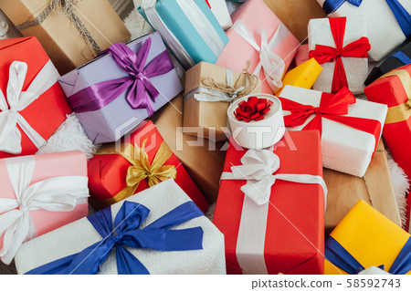 Lots of multi-colored gifts for the surprise holiday 58592743