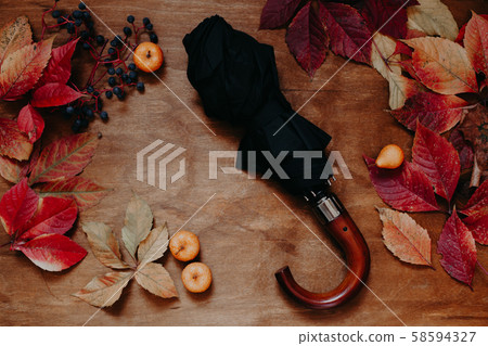 autumn background table with red and yellow fallen leaves 58594327
