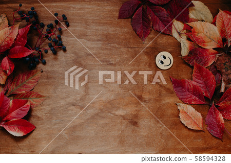 autumn background table with red and yellow fallen leaves 58594328