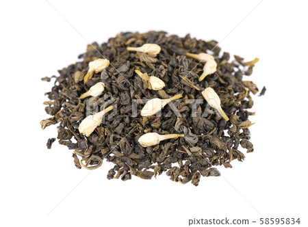 Green tea with jasmine, isolated on white background. Aromatic green dry tea, close up. Green tea with jasmine, isolated on white background. Aromatic green dry tea, close up. 58595834