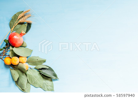 autumn yellow leaves fruit nuts on the table 58597940