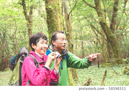 Trekking senior bird watching Trekking senior bird watching 58598311
