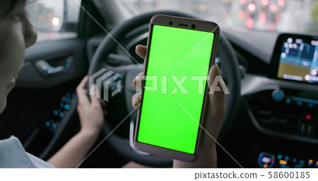 green screen phone in car 58600185