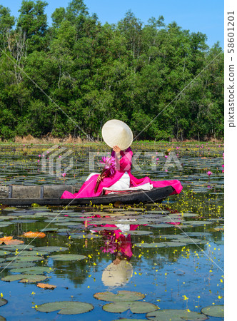 Asian woman on the wooden boat 58601201