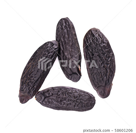 Tonka beans isolated on white background. Bean of Dipteryx odorata, cumaru or kumaru. Fresh aroma 58601206