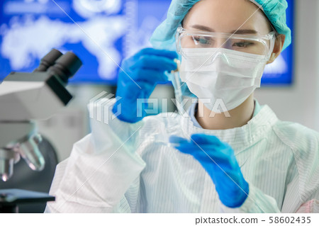 asian scientist take petri dish 58602435