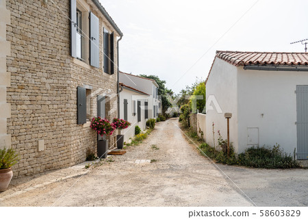 Picturesque street in village in the Island of Re 58603829