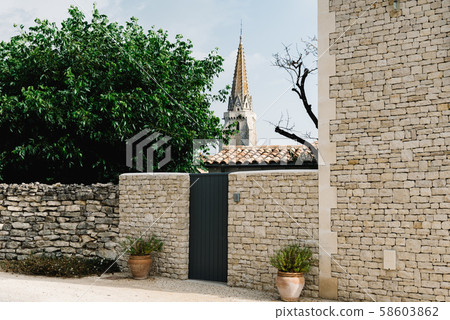 Picturesque street in village in the Island of Re 58603862