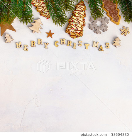 Merry Christmas written with wooden letters, cookies and Christmas decorations 58604880