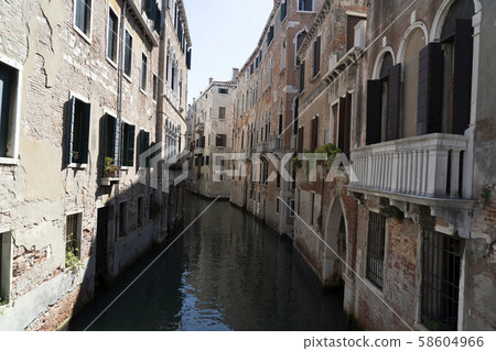 Venice bridge and channel reflections 58604966