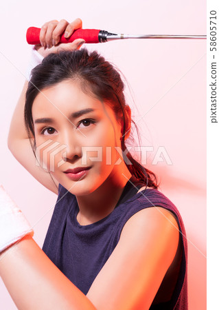 Female athlete badminton 58605710