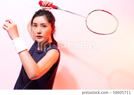 Female athlete badminton 58605711