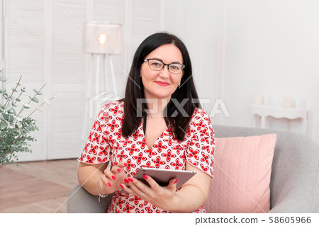Portrait of a brunette woman in a red and white Portrait of a brunette woman in a red and white 58605966