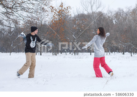 Loving couple having fun, laughing, playing and 58606330