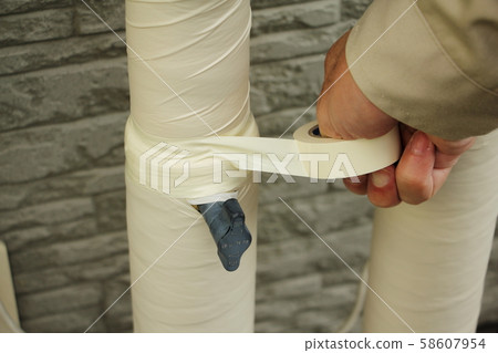 Wrap vinyl tape around piping Wrap vinyl tape around piping 58607954