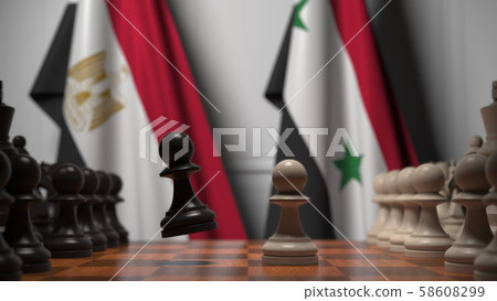 Flags of Egypt and Syria behind pawns on the chessboard. Chess game or political rivalry related 3D 58608299