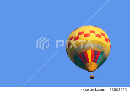 Colorful hot air balloon isolate on blue sky Colorful hot air balloon isolate on blue sky 58608953