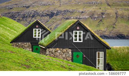 Typical houses of Faroe Islands with grass on the roof 58609777