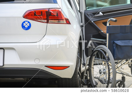 Person with a disability, wheelchair, car image Person with a disability, wheelchair, car image 58610028