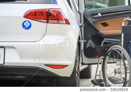 Person with a disability, wheelchair, car image Person with a disability, wheelchair, car image 58610029