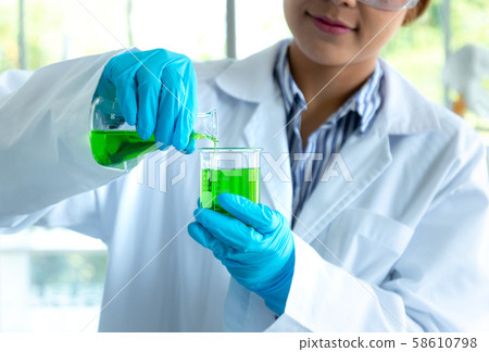 chemist scientis female doing experiments and 58610798