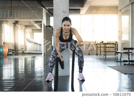 Sporty fit woman workout exercises. Muscular of Sporty fit woman workout exercises. Muscular of 58611070